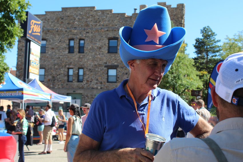 Mike Mullins, an event volunteer for YoColorado, dons a large cowboy hat for Wild West Oktoberfest Sept. 24 in downtown Golden.